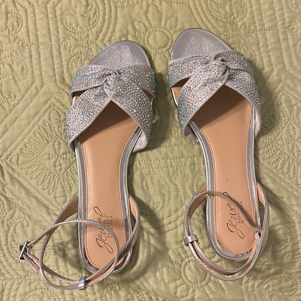 Fun flat that feature a sparkling pair of rhinestone straps.